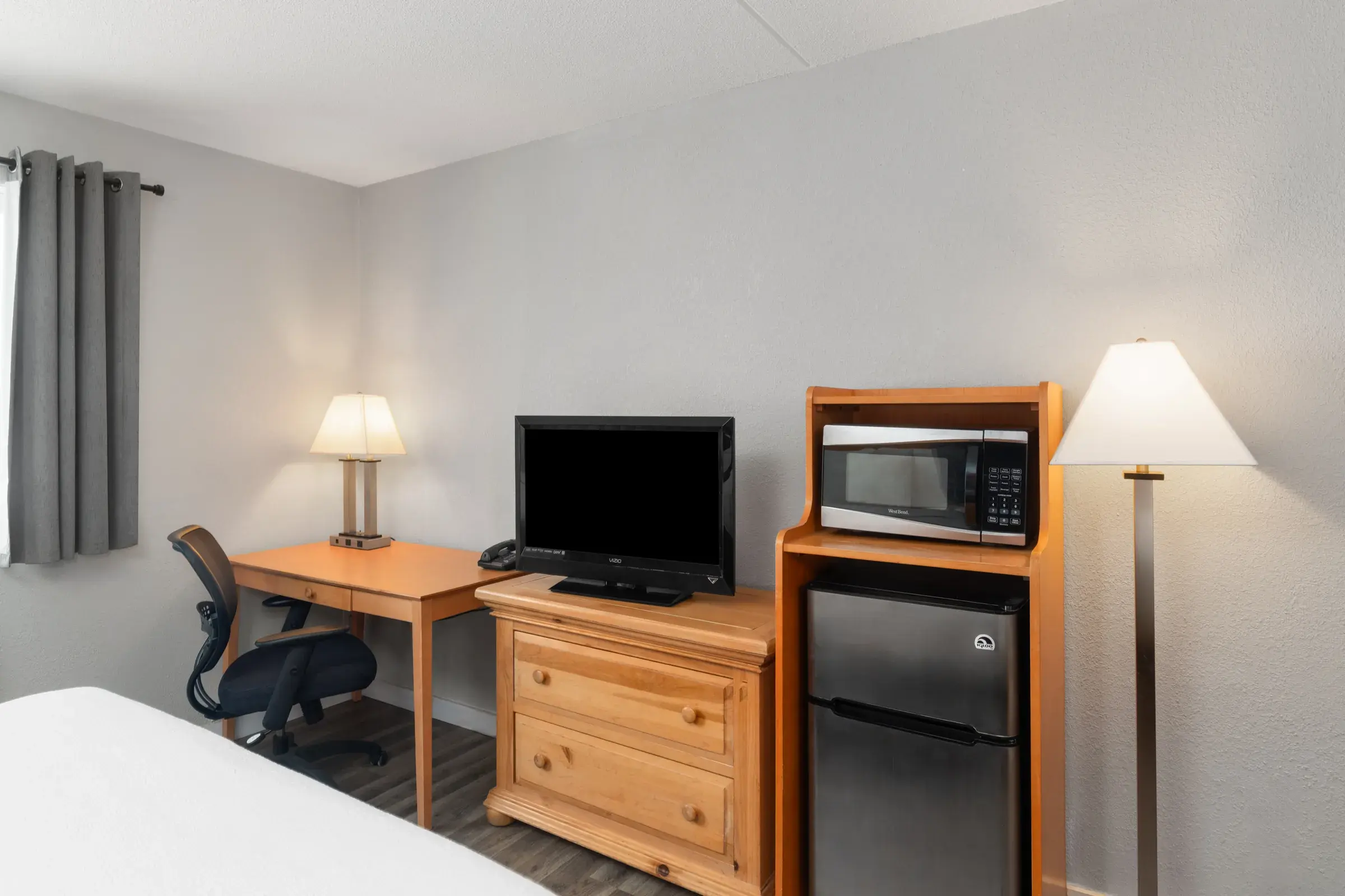 Two queen beds with warm lighting