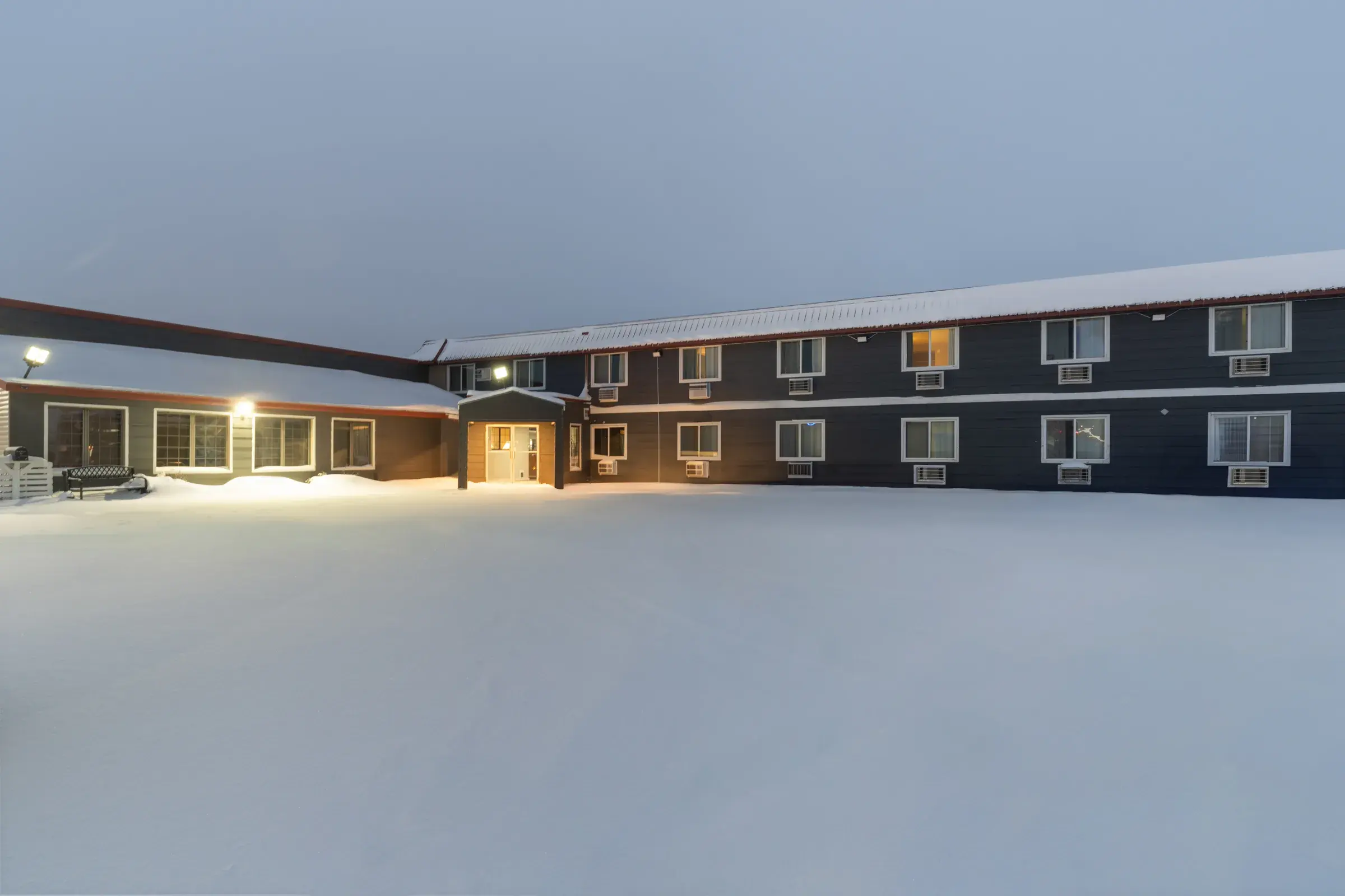 The inn glowing at dusk